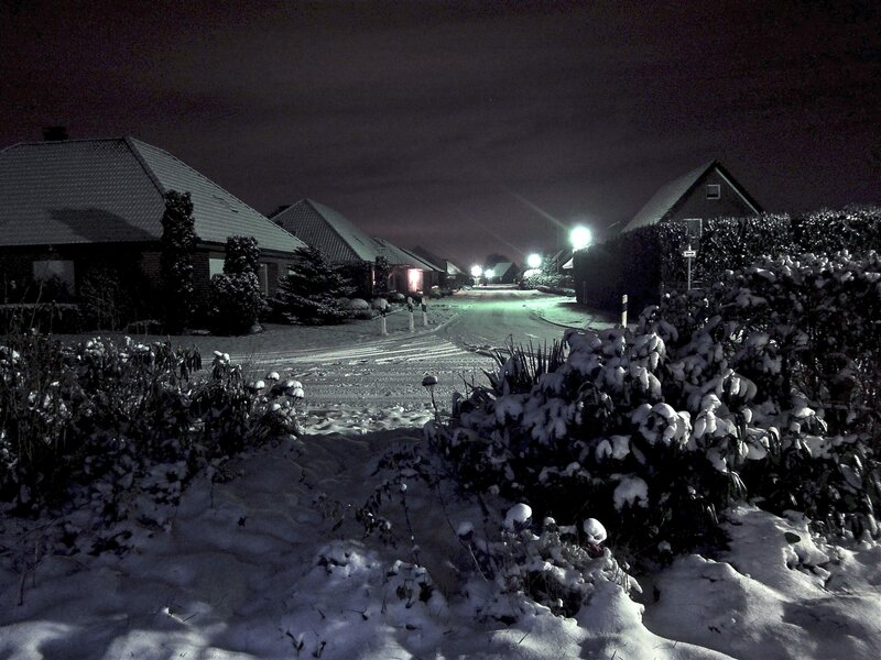 Snowy night in a quiet neighborhood