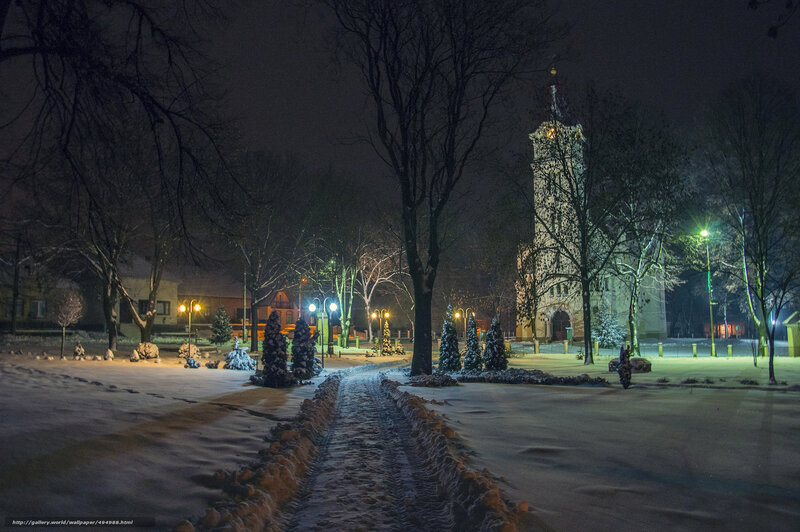 Snowy night in a town square