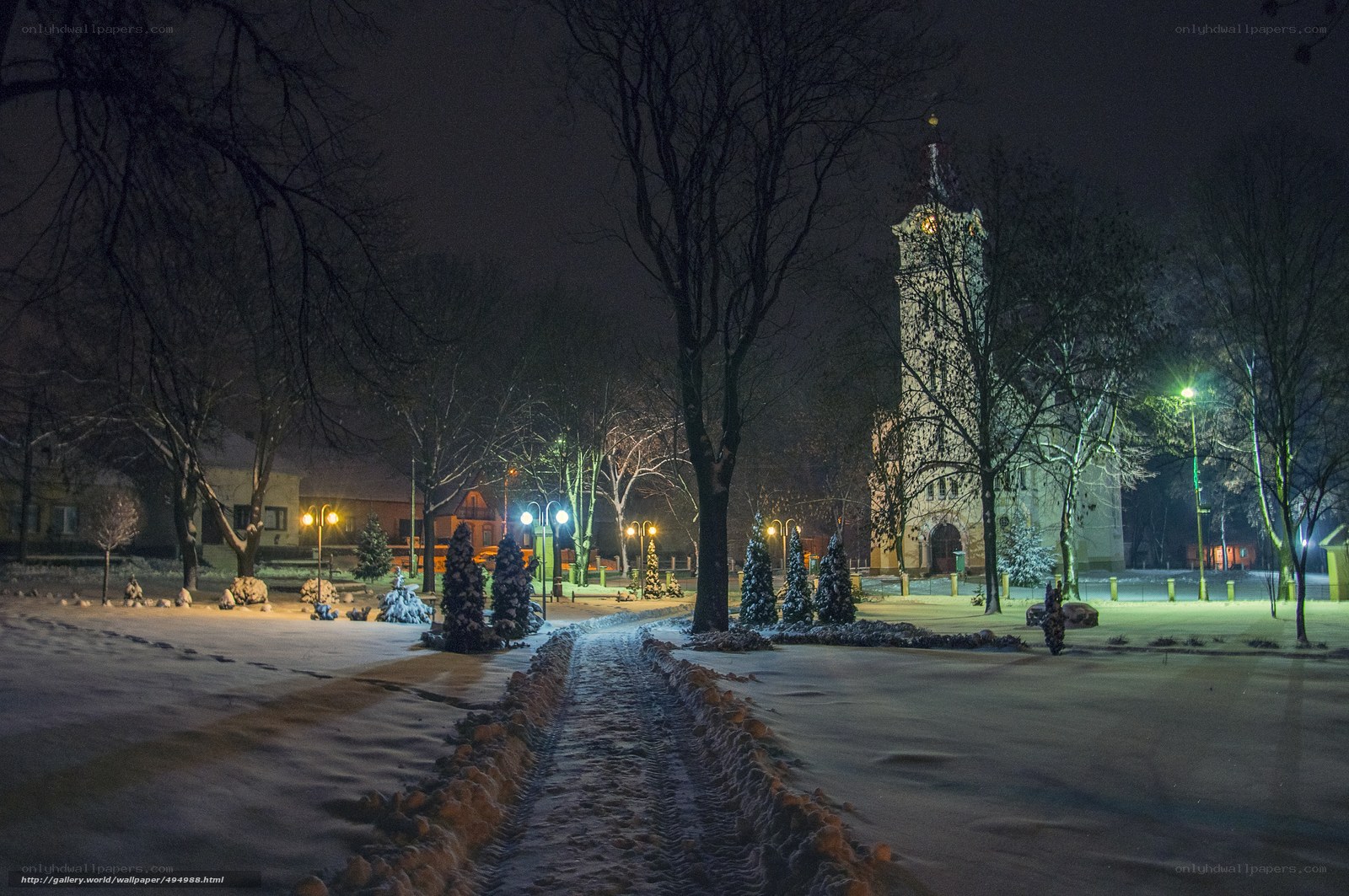 Snowy night in a town square