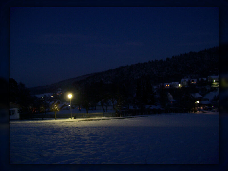 Snowy night in a village