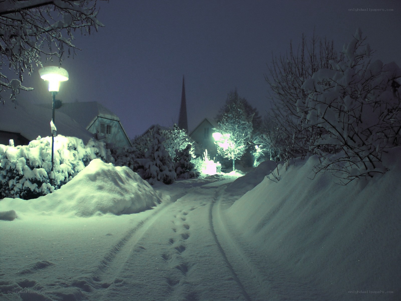 Snowy night path in village