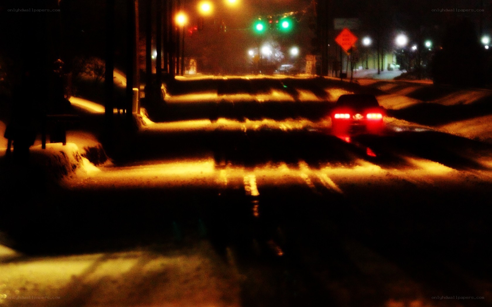 snowy night street with car