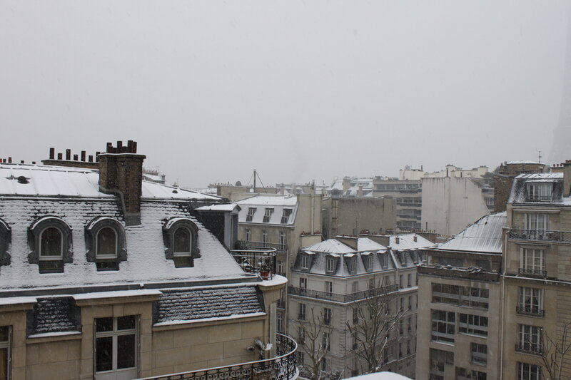 Snowy Paris rooftops