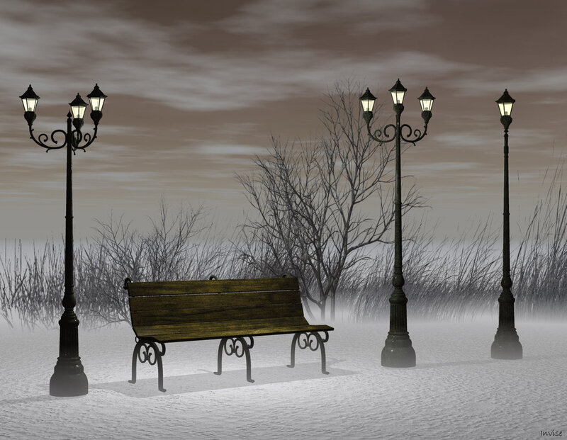 Snowy park bench at night