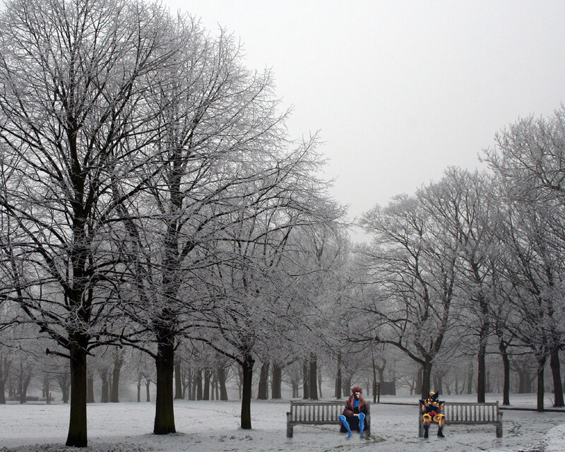 Snowy park with costumed figures