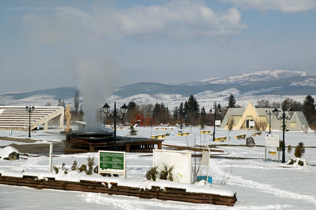 Snowy park with steam vent