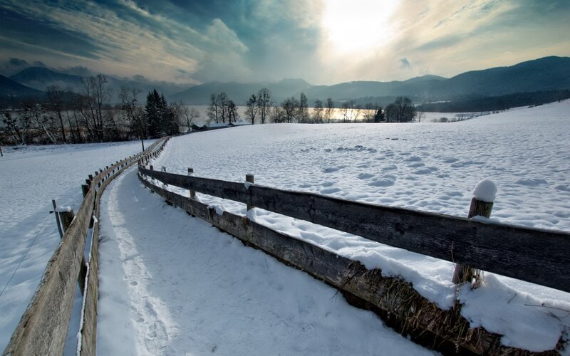 Snowy path by a lake
