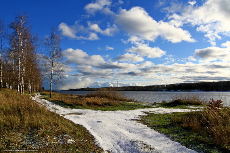 Snowy path by a lake
