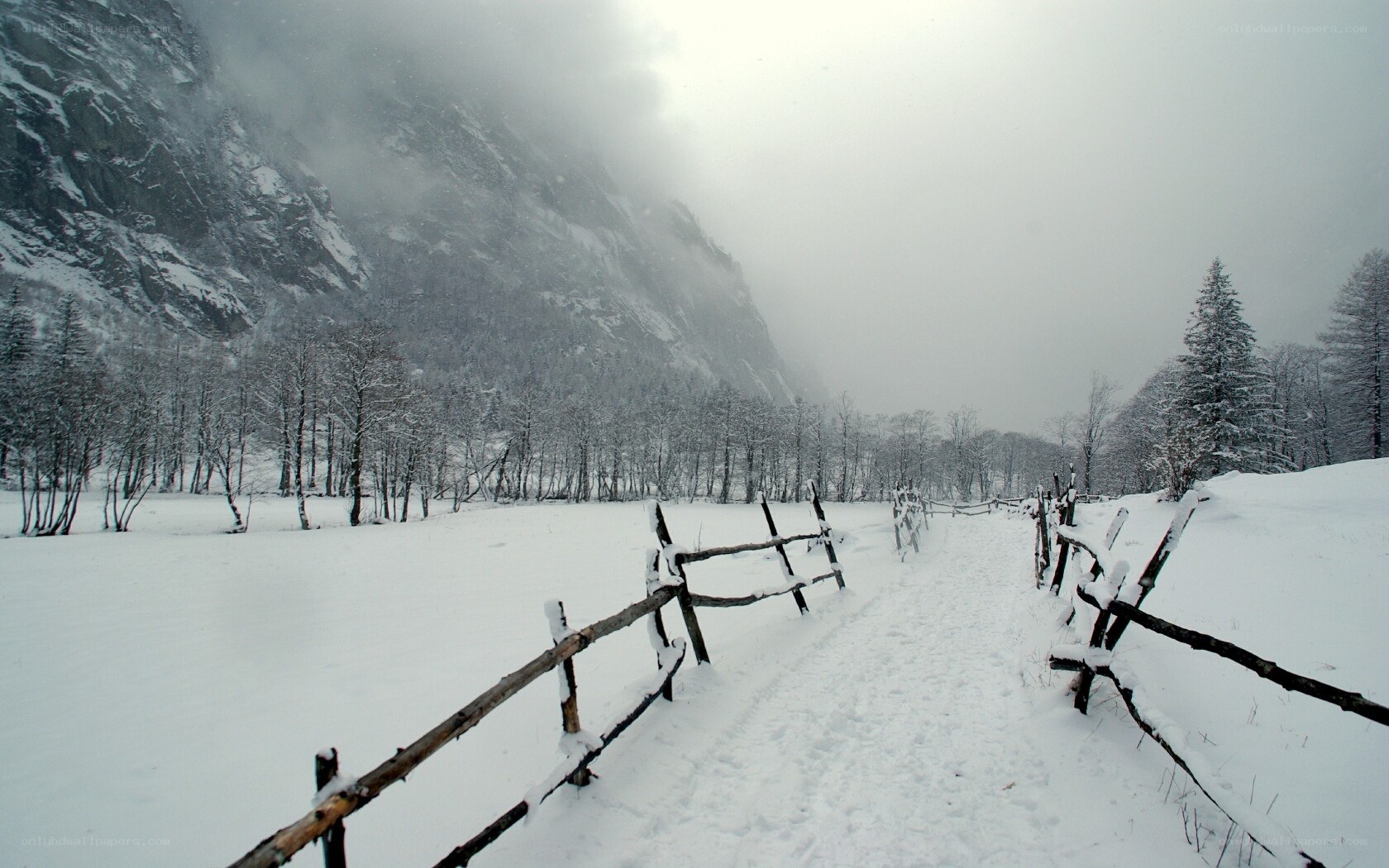 Snowy path in mountain valley