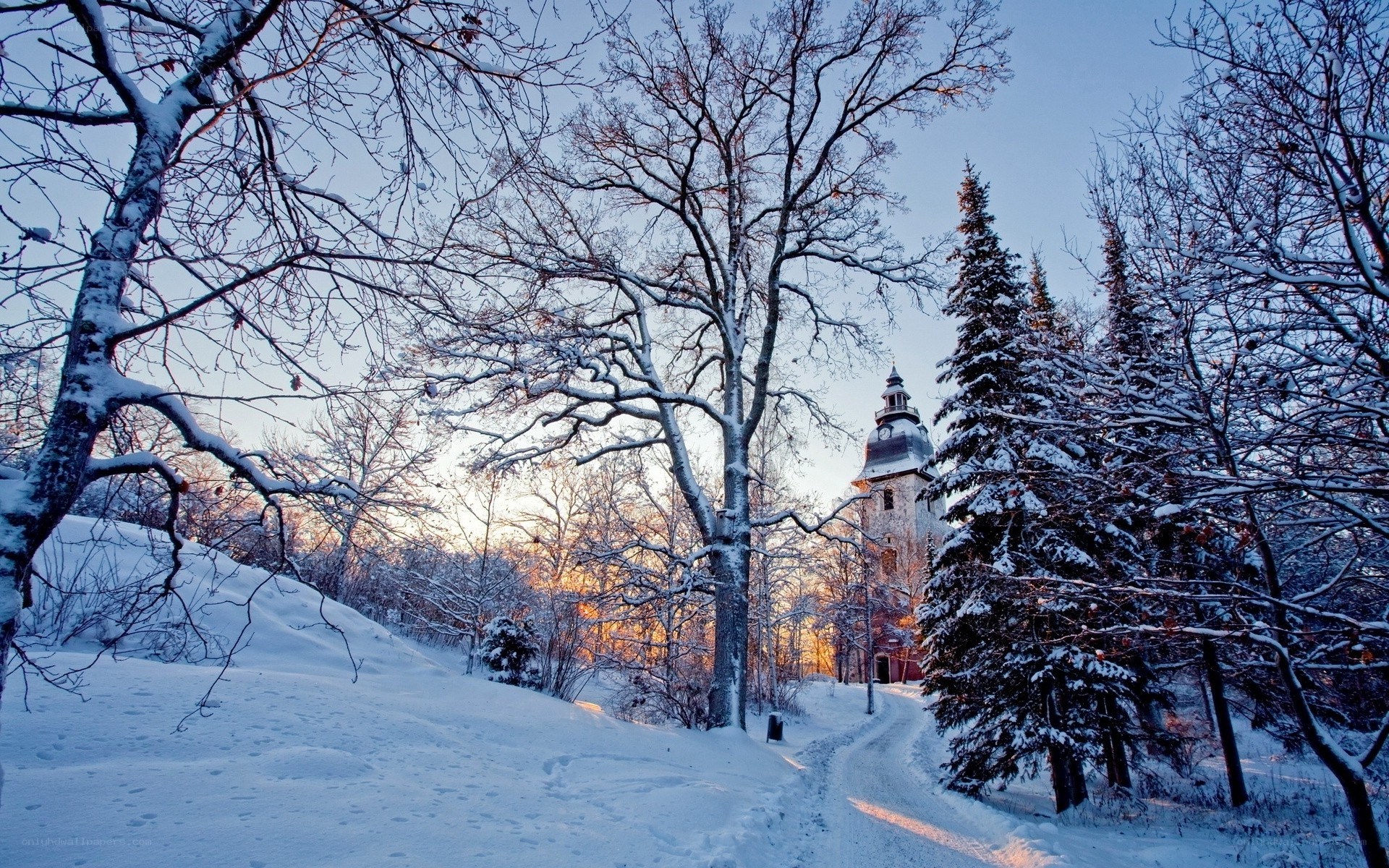 Snowy path to a church tower