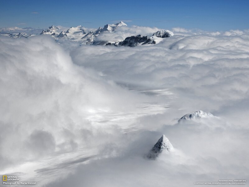 Snowy peaks above clouds