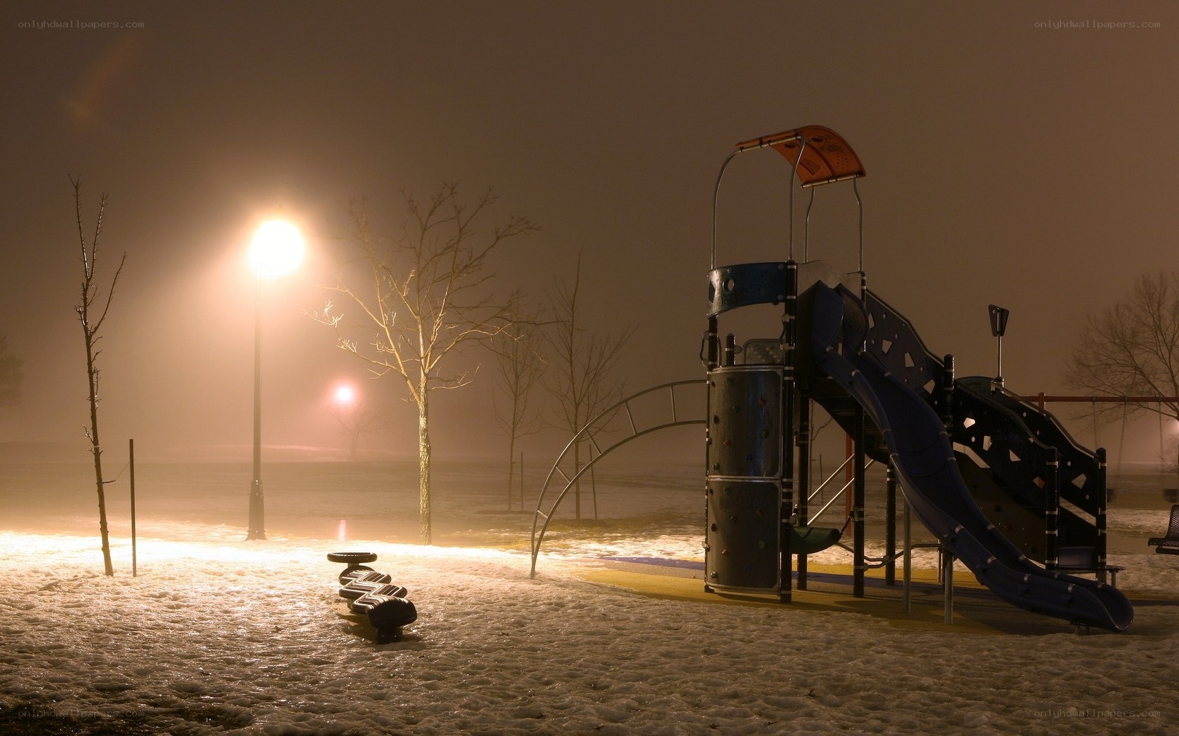 snowy playground at night