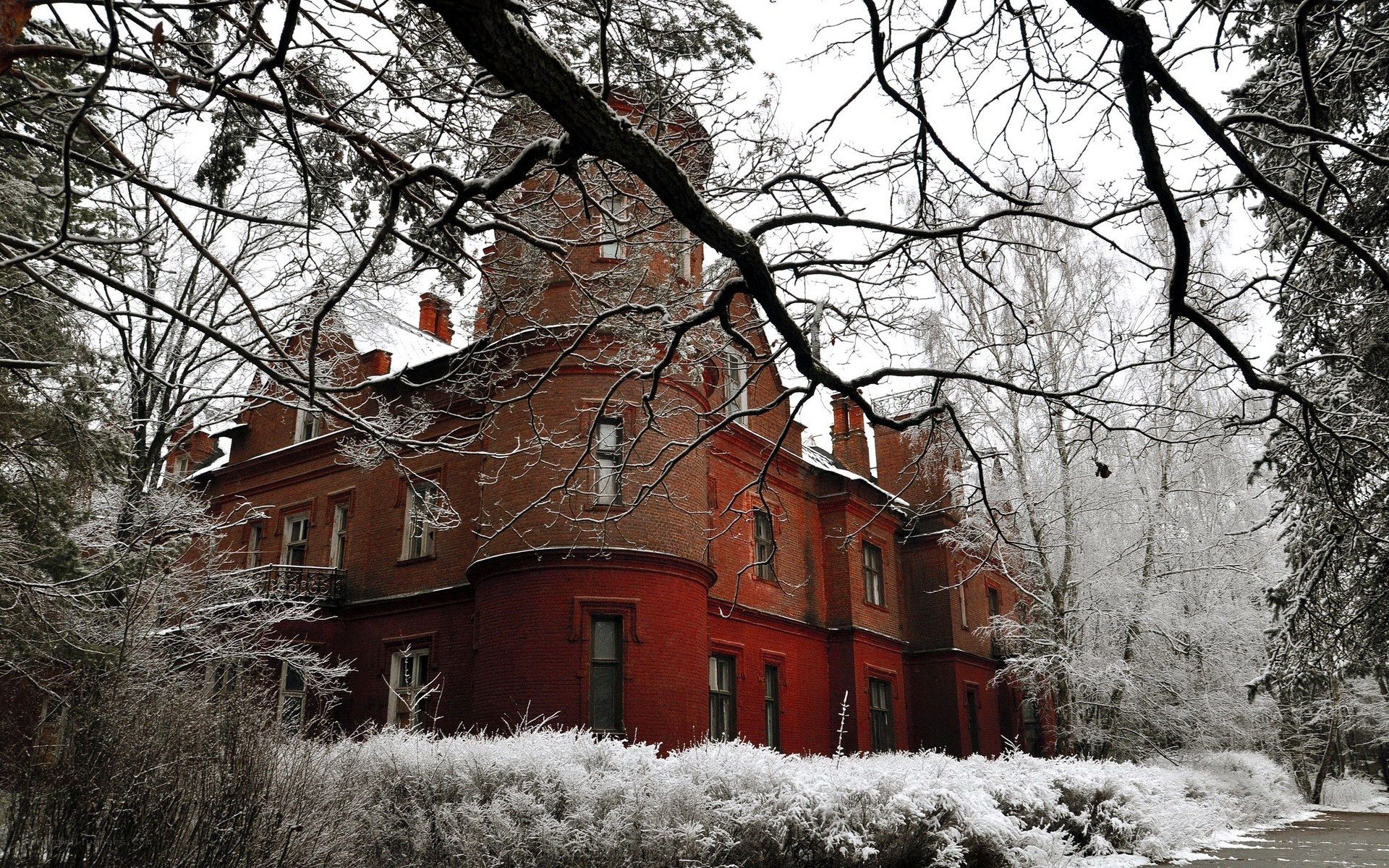 Snowy red brick mansion