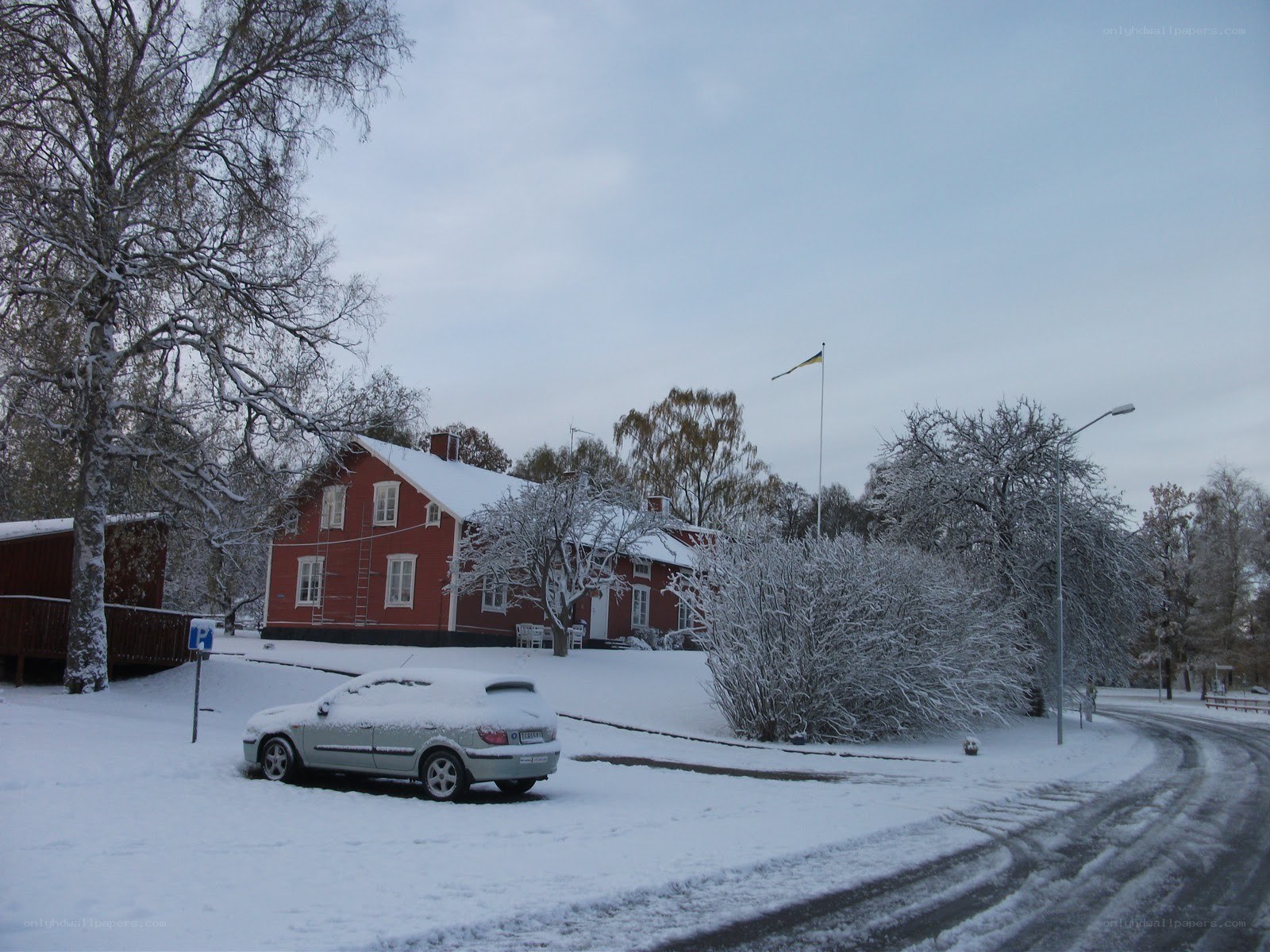 Snowy red house in winter