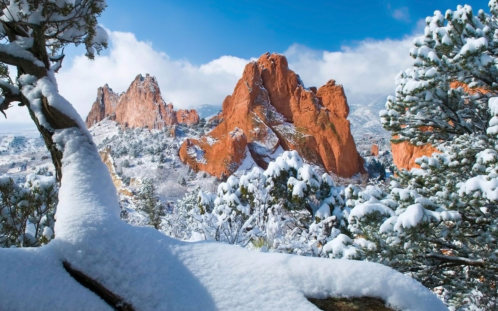 Snowy red rock formations
