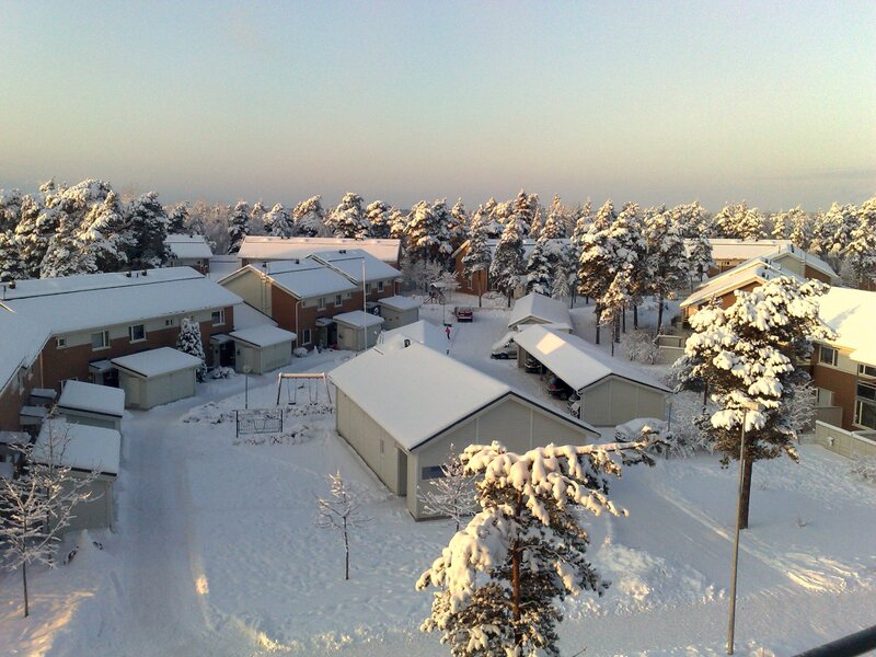 Snowy residential neighborhood at dawn