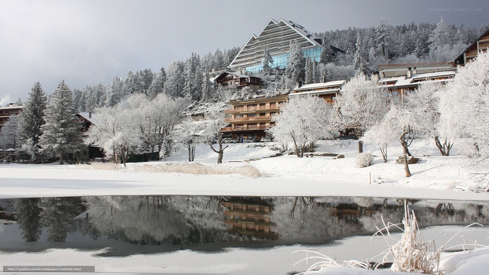 Snowy resort by a frozen lake