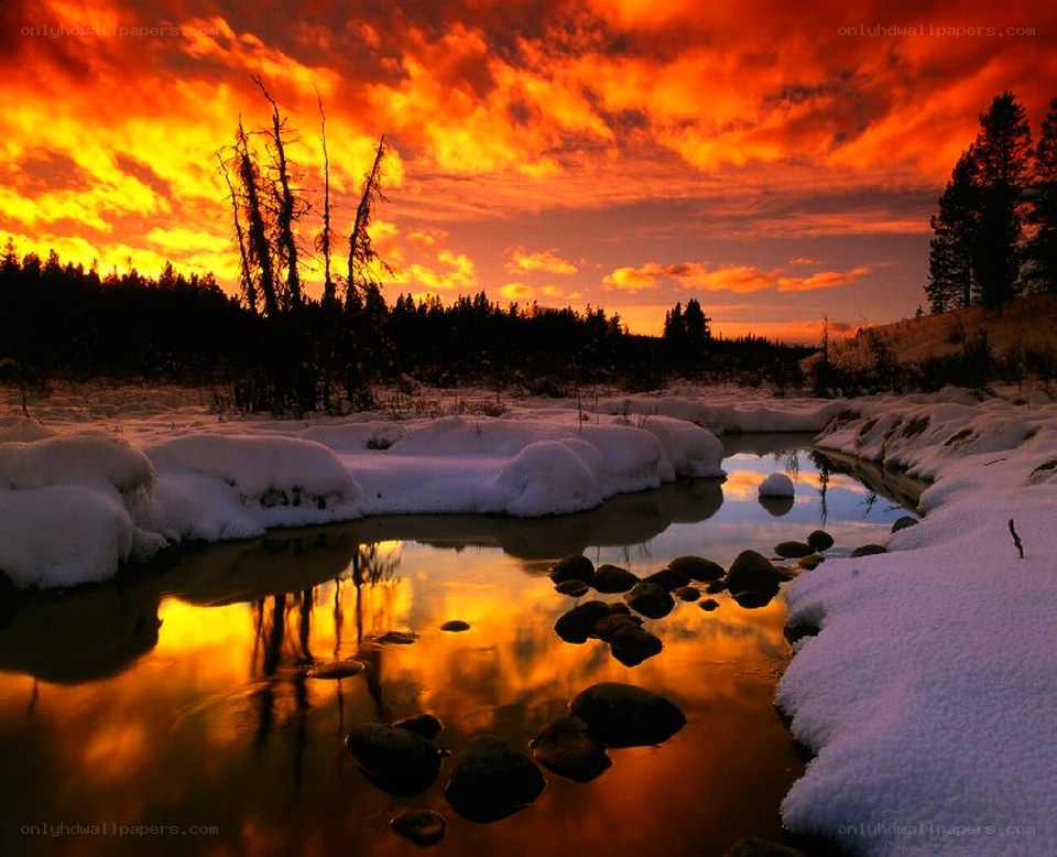 Snowy river at sunset