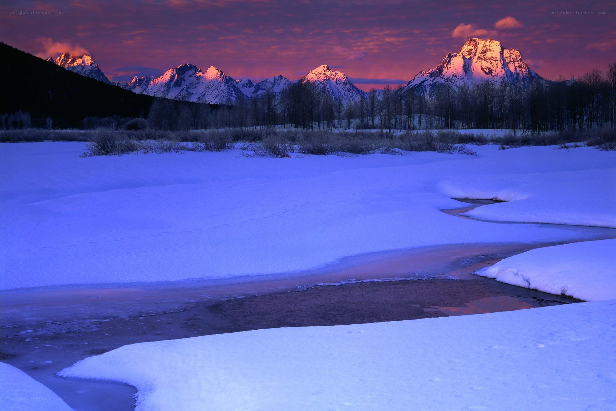 Snowy river at sunset