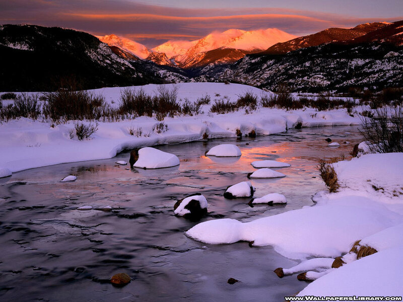 Snowy river at sunset