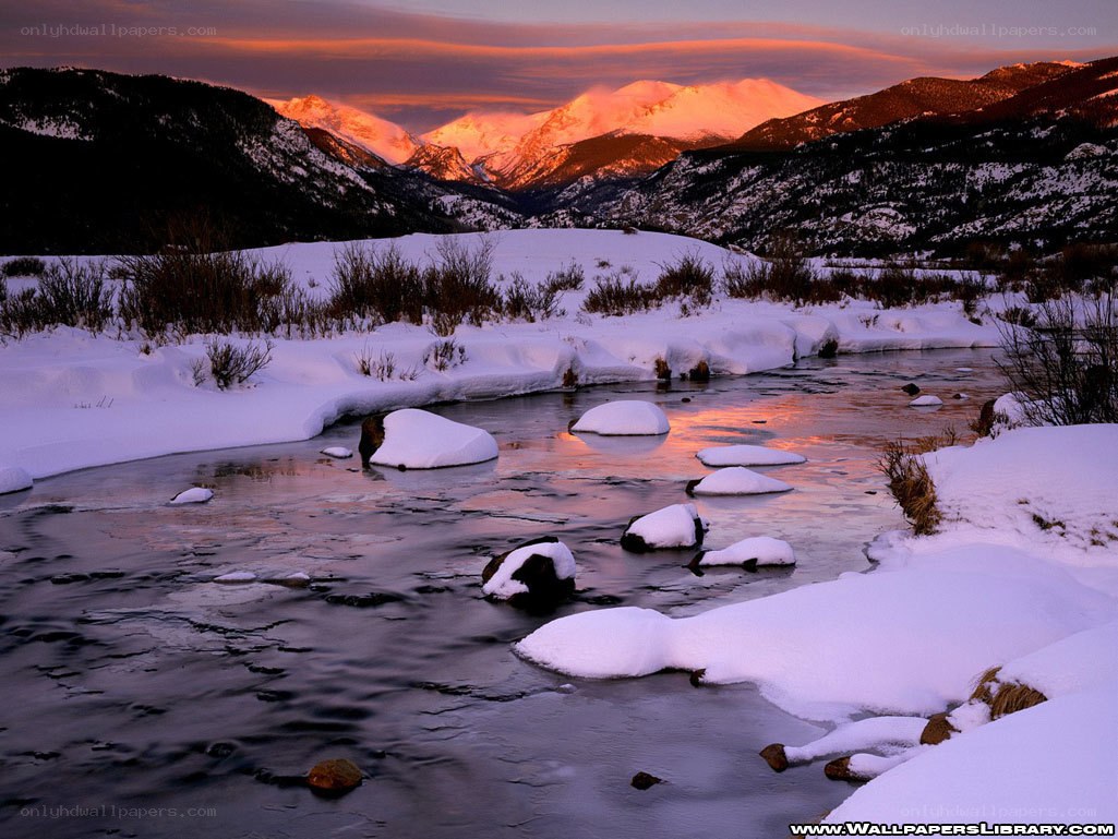Snowy river at sunset
