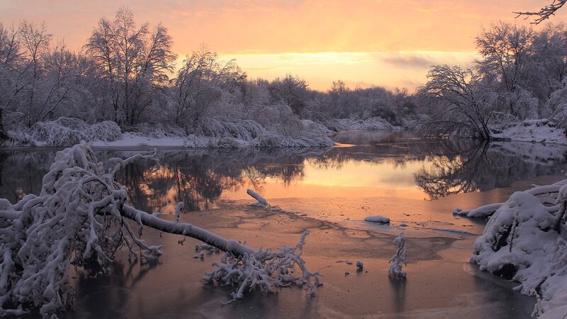 Snowy river at sunset