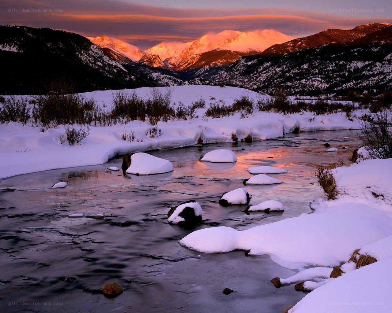 Snowy river at sunset