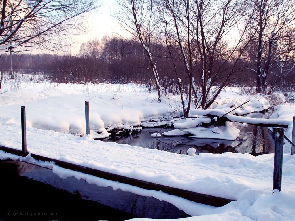 Snowy river at sunset