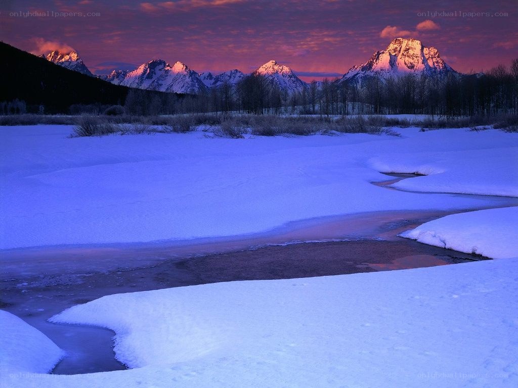 Snowy river at sunset