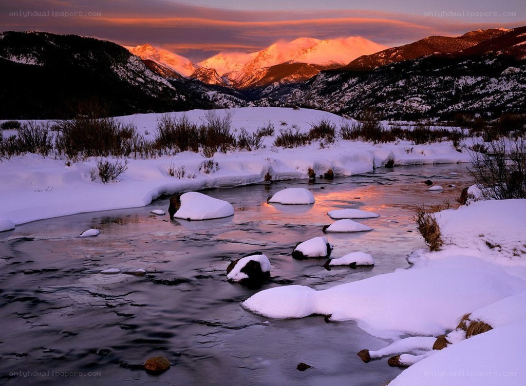 Snowy river at sunset