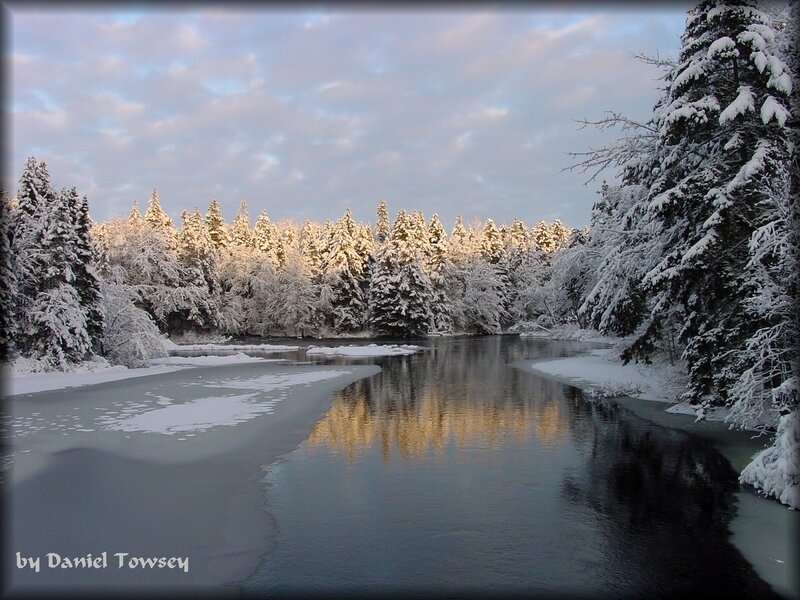 Snowy river at sunset