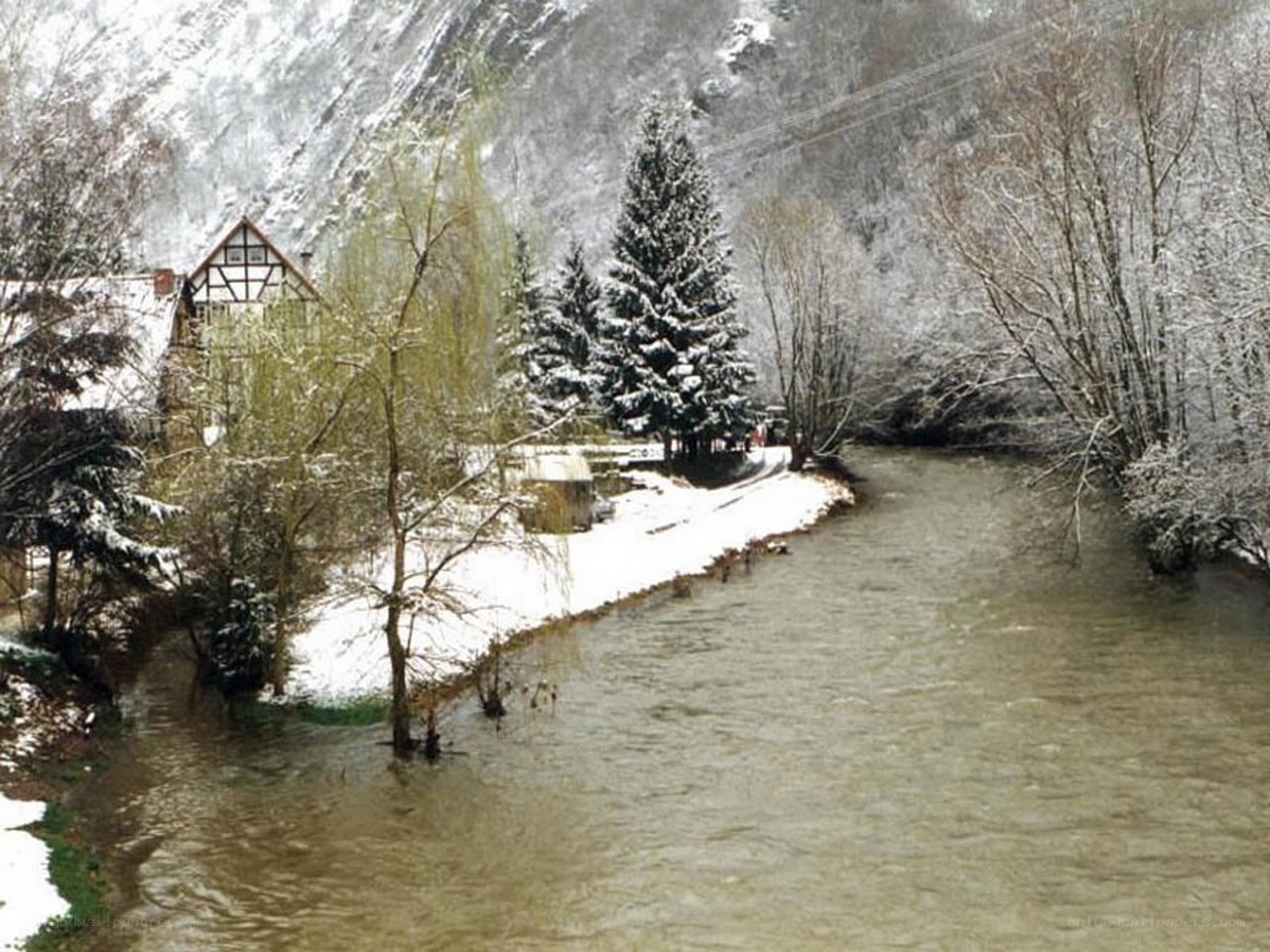 Snowy river in a valley