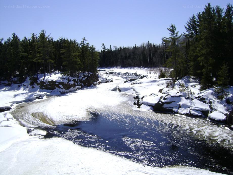 snowy river in forest
