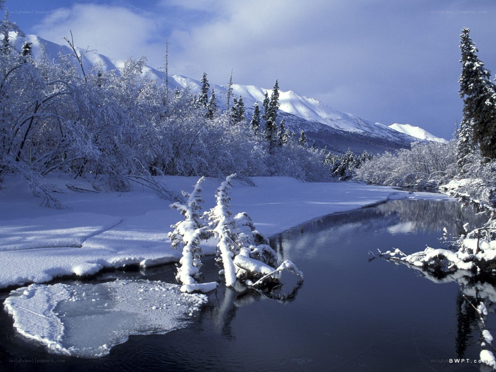 Snowy river in mountain landscape