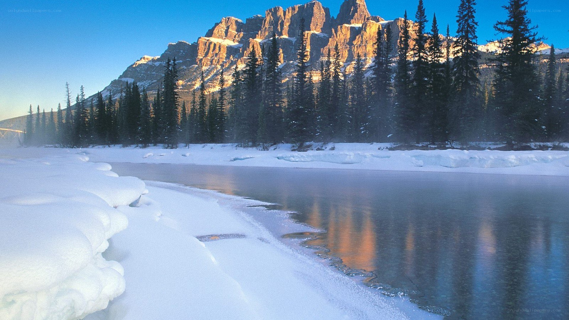 Snowy river in mountain valley