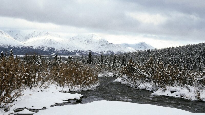 Snowy river in mountain valley