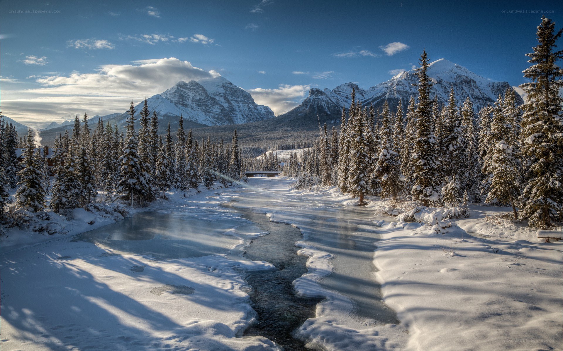 Snowy river in mountain valley