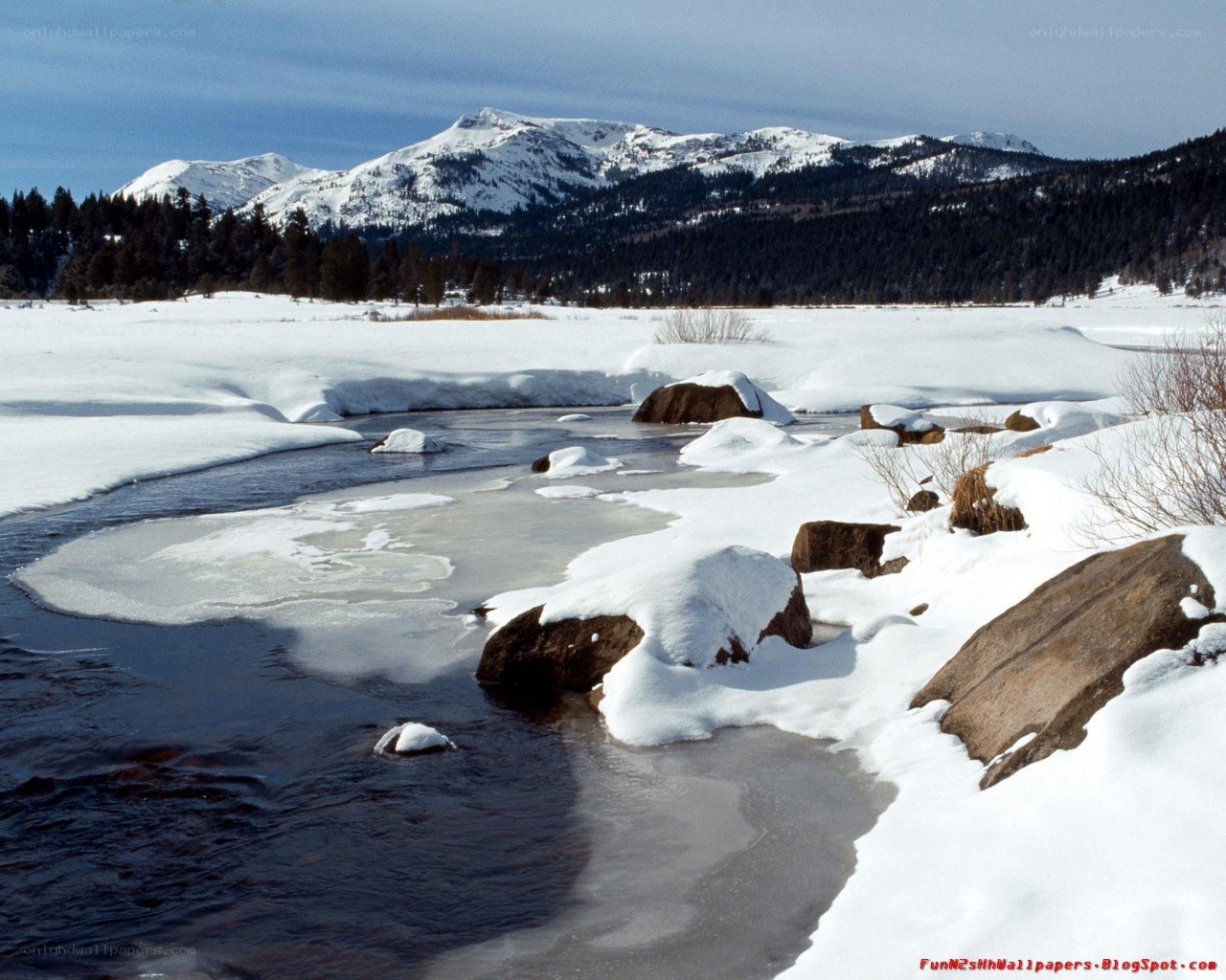 Snowy river in mountain valley