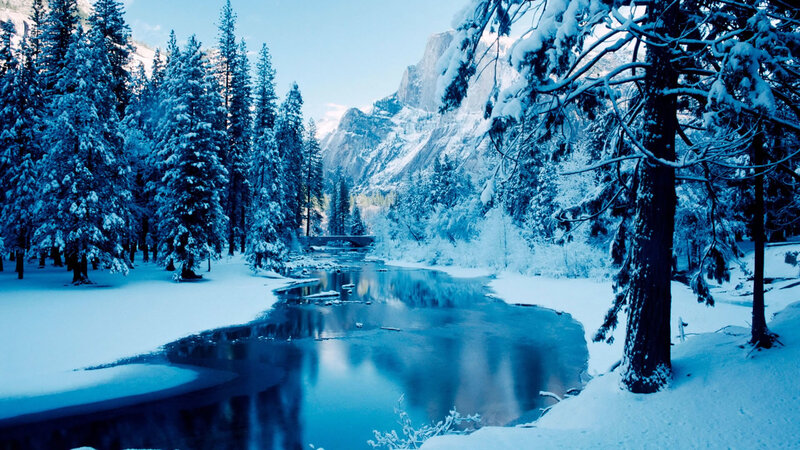 Snowy river in mountain valley