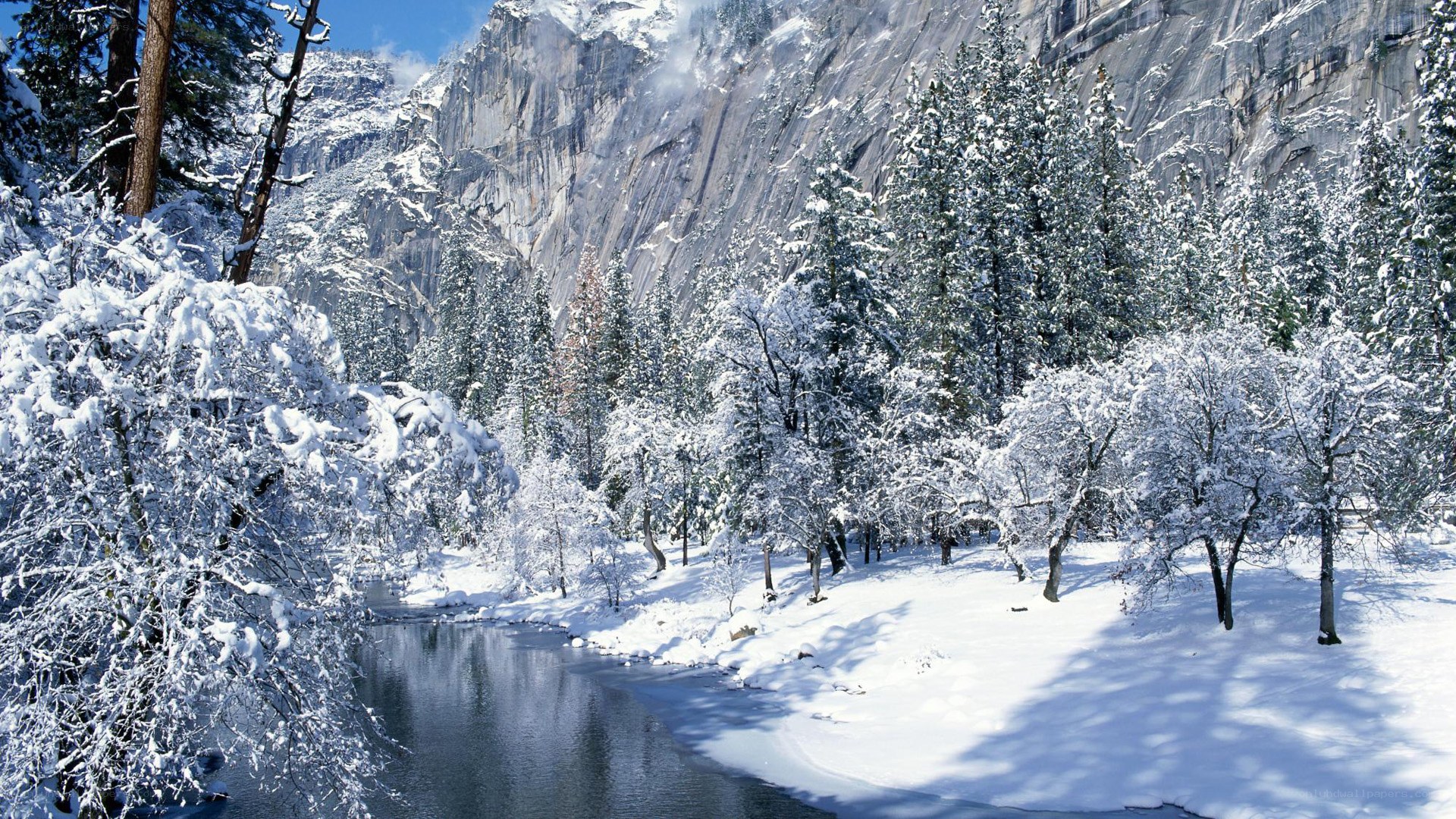 Snowy river in mountain valley