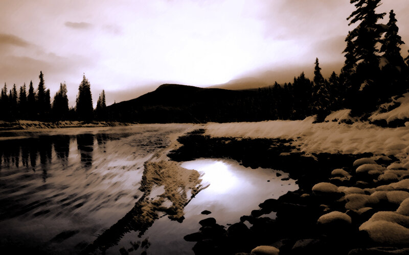 Snowy river landscape at dusk