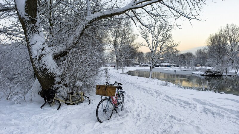 Snowy river path with bicycles