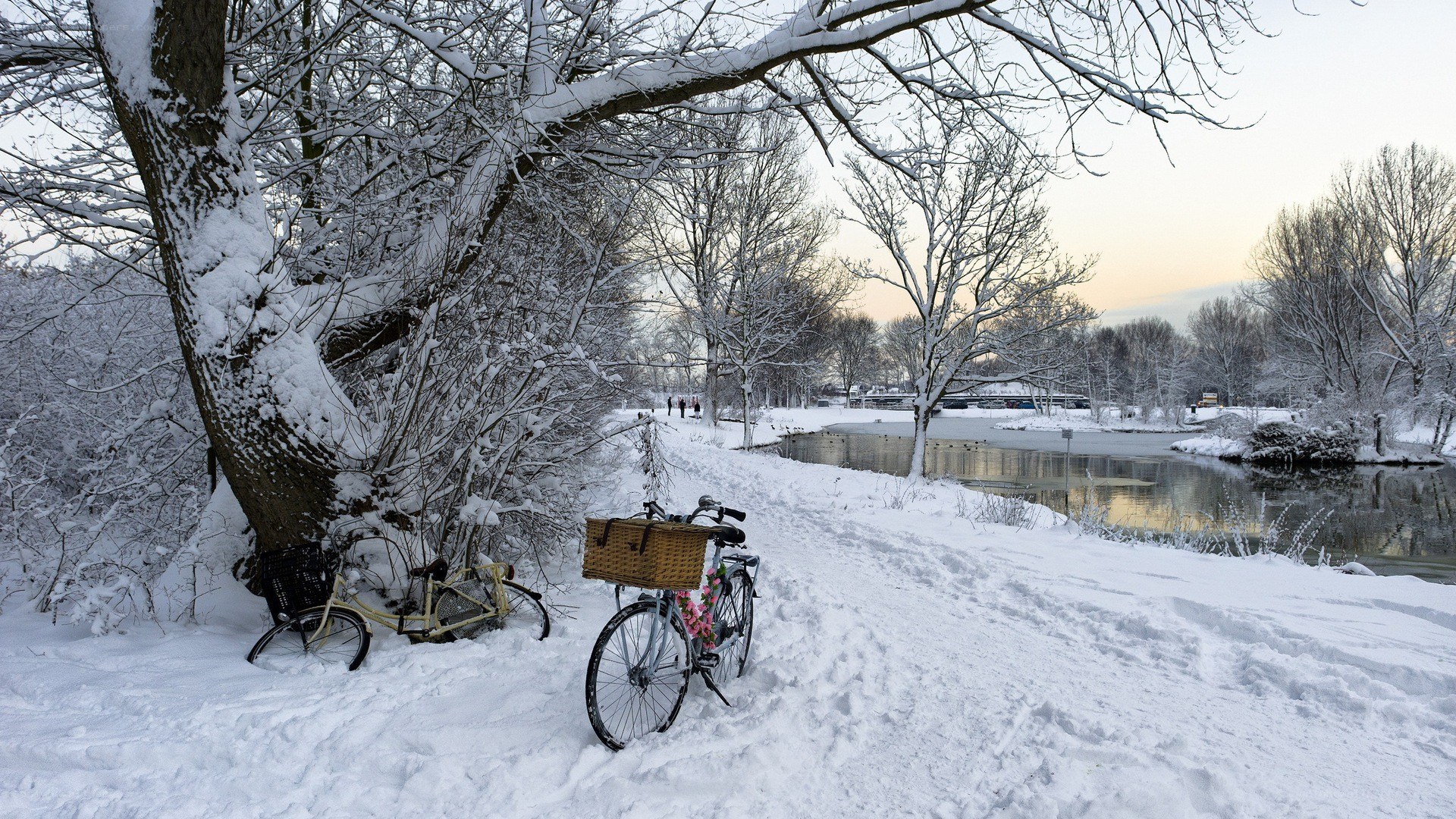 Snowy river path with bicycles