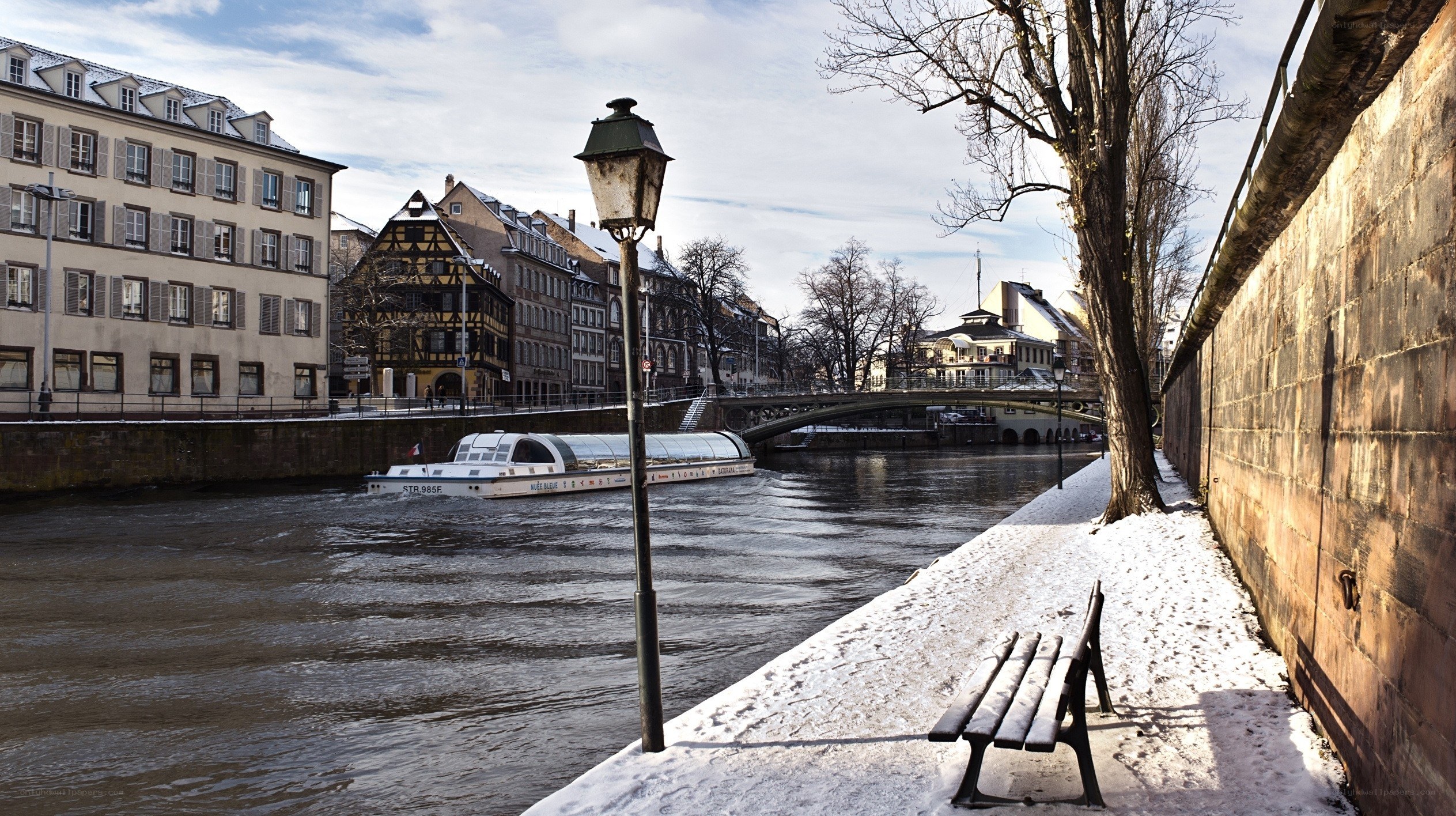 Snowy river scene in Strasbourg