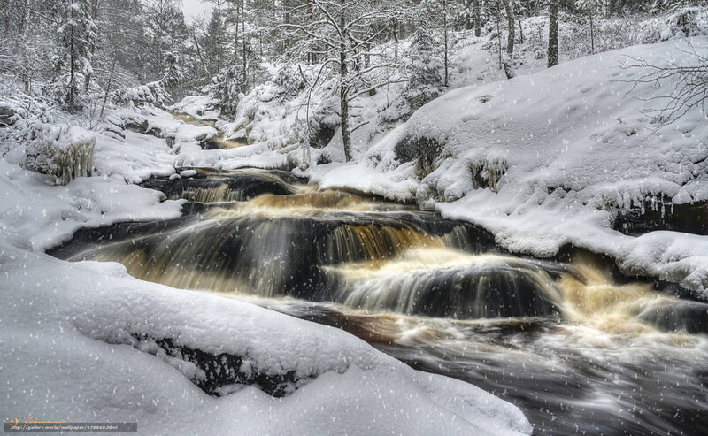 Snowy river waterfall in winter