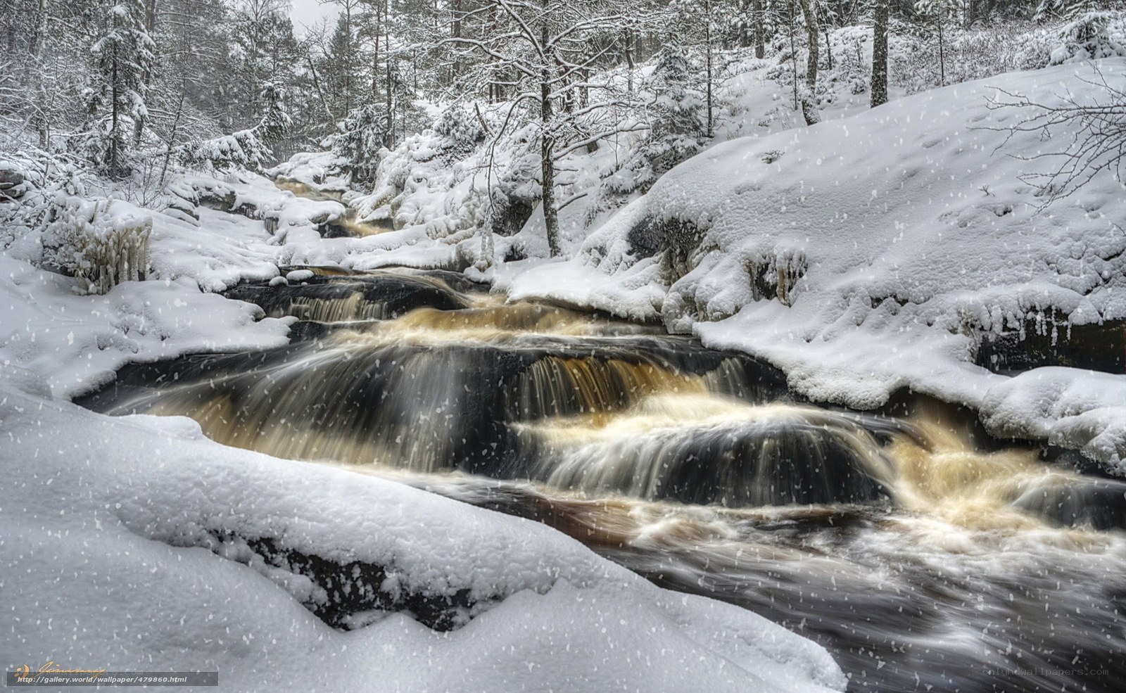 Snowy river waterfall in winter