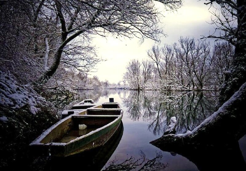 Snowy river with boats