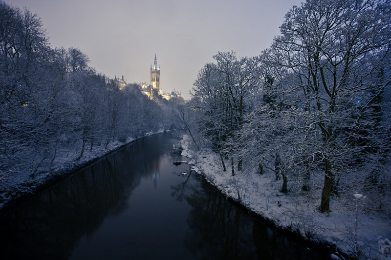 Snowy river with castle in distance