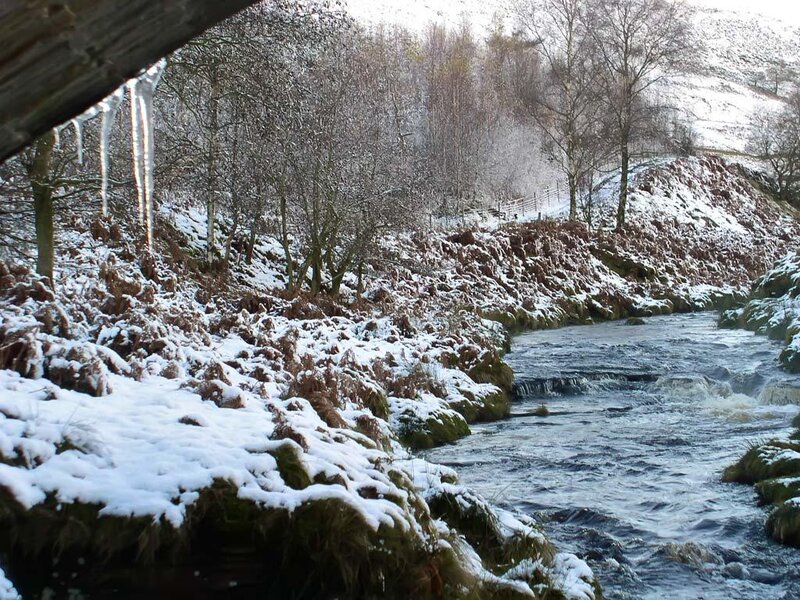 snowy river with ice formations