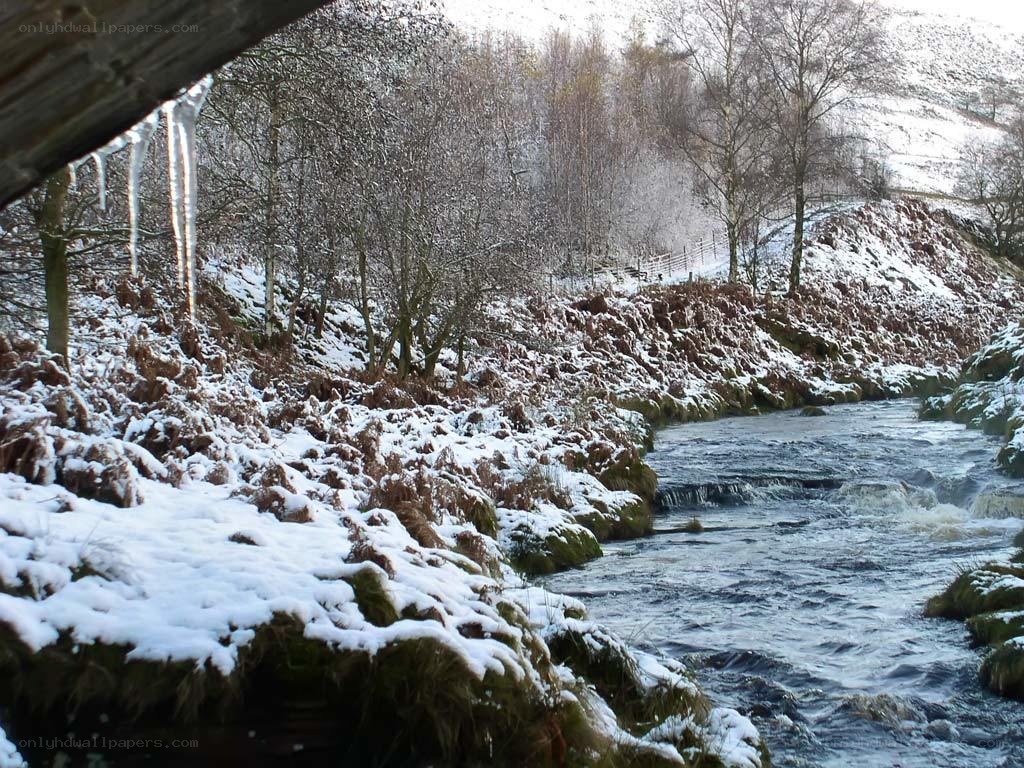 snowy river with ice formations